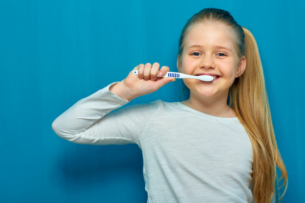 Girl Cleaning Teeth